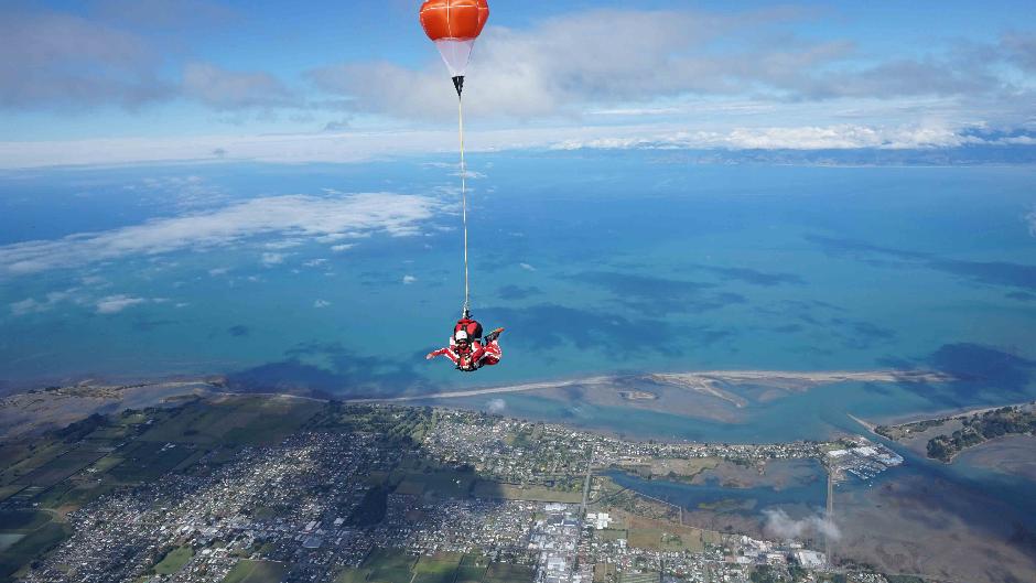 Enjoy a panoramic flight with stunning views as you climb to 13,000ft over snow-capped mountains, golden beaches and turquoise oceans then... JUMP!